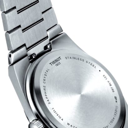 Reloj Tissot T1374101104100 circulo metalico, eslabones metalicos plateados, texto